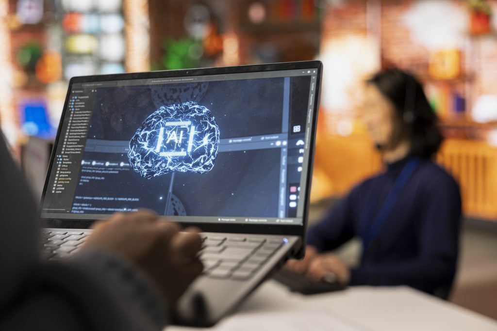 Closeup of support worker using artificial intelligence for customer replies